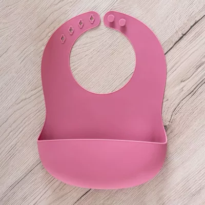 Bavetica din silicon moale cu buzunar colector pentru bebelusi, reglabila, roz, Reer Eat`n Tidy 25044