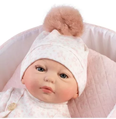 Papusa reborn prematura Silvia, 38 cm, in cosulet roz, pictata manual, corp textil si membre din vinil, cu accesorii incluse